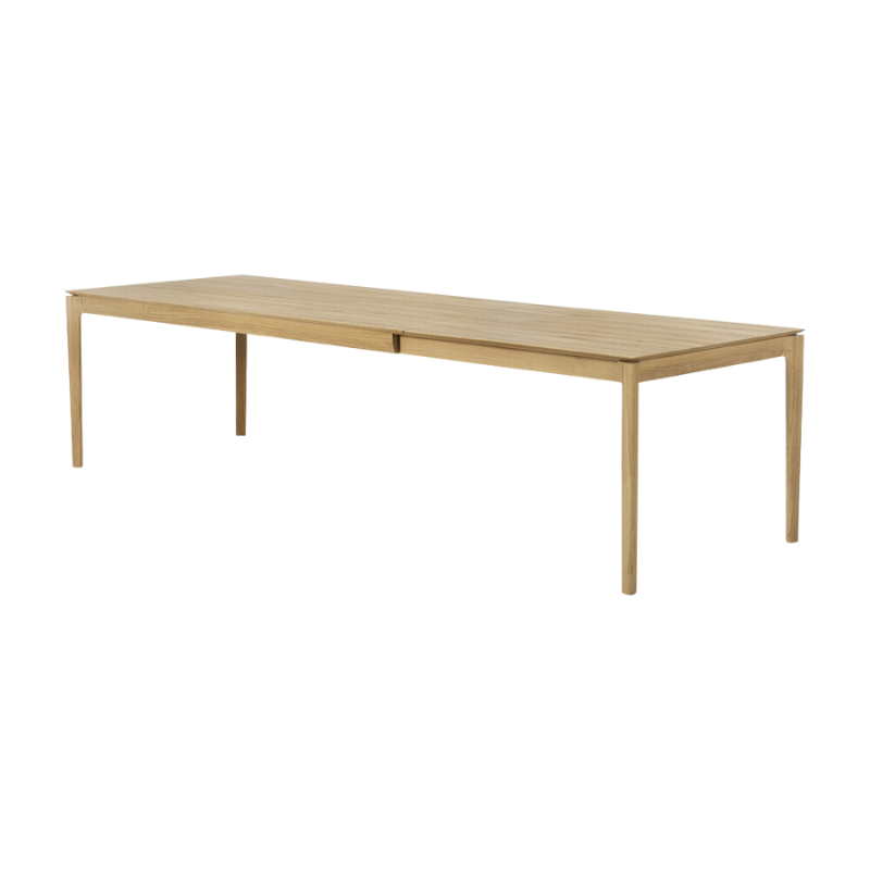 The 79 to 118 inch Bok Extendable Dining Table from Ethnicraft in oak extended from an angle.