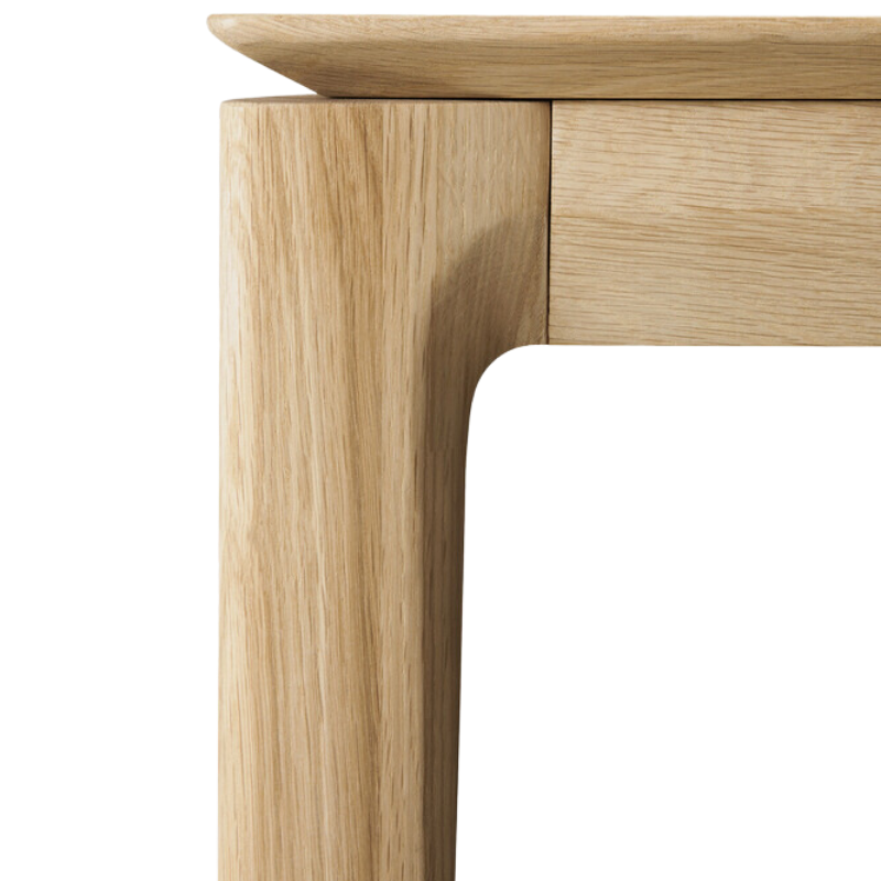 The Bok Extendable Dining Table from Ethnicraft in oak focusing on the design.