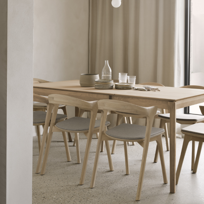 The Bok Extendable Dining Table from Ethnicraft in oak in a dining room.