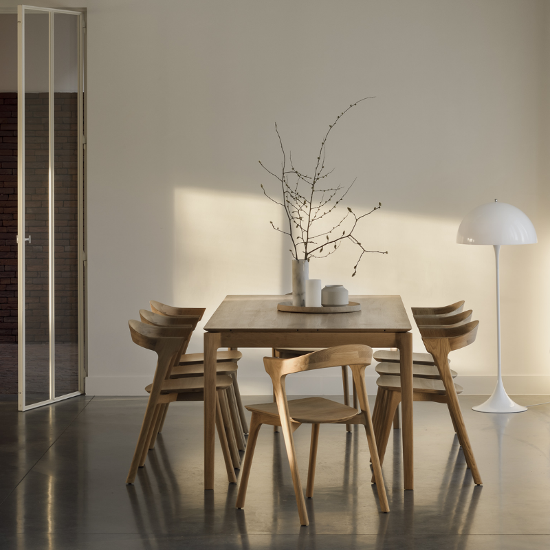 The Bok Extendable Dining Table from Ethnicraft in oak in a living room.