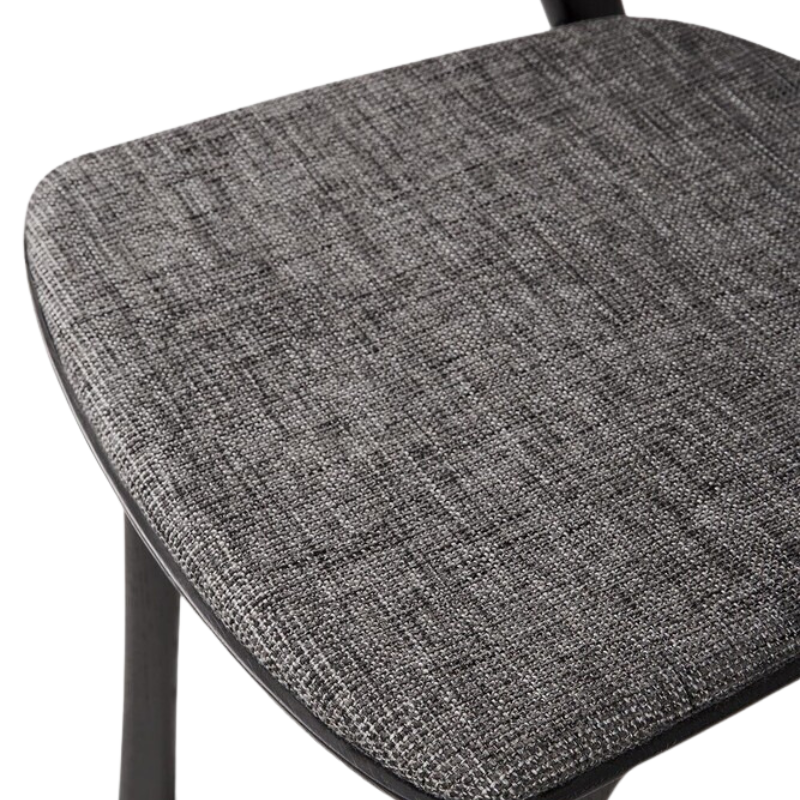 The Bok Upholstered Dining Chair from Ethnicraft in black oak with grey fabric seat.