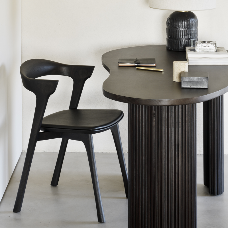 The Bok Upholstered Dining Chair from Ethnicraft in a business.