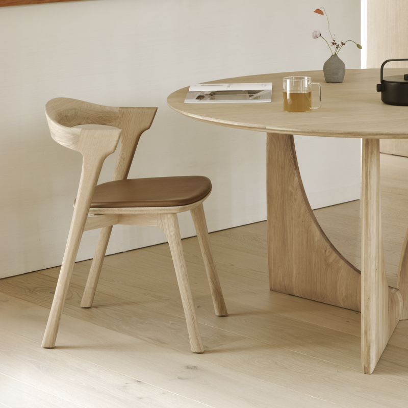 The Bok Upholstered Dining Chair from Ethnicraft in a dining room.