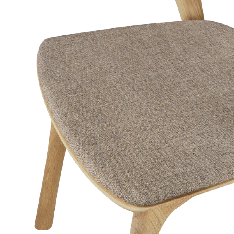 The Bok Upholstered Dining Chair from Ethnicraft in oak with warm grey fabric seat.