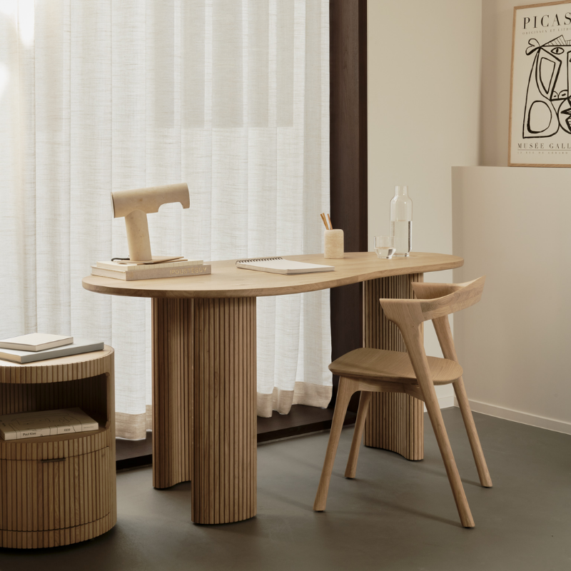 The Boomerang Drawer Unit Oak by Ethnicraft in a living room.