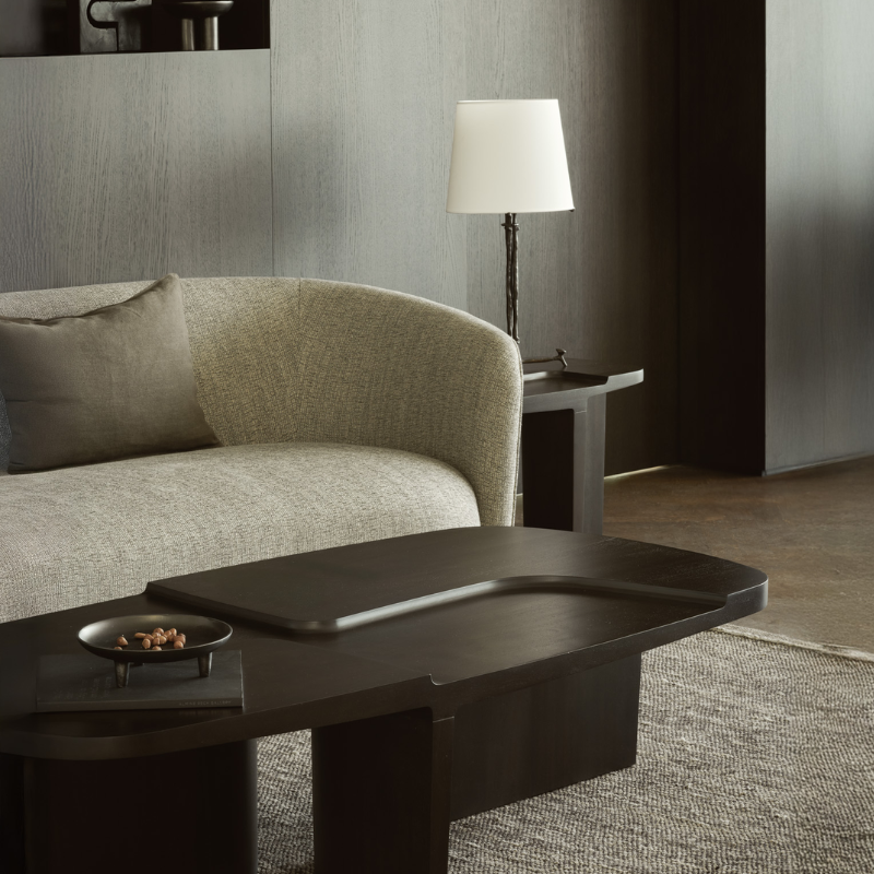 The Brutalist Rectangular Coffee Table by Ethnicraft in a living room with a grey sofa.