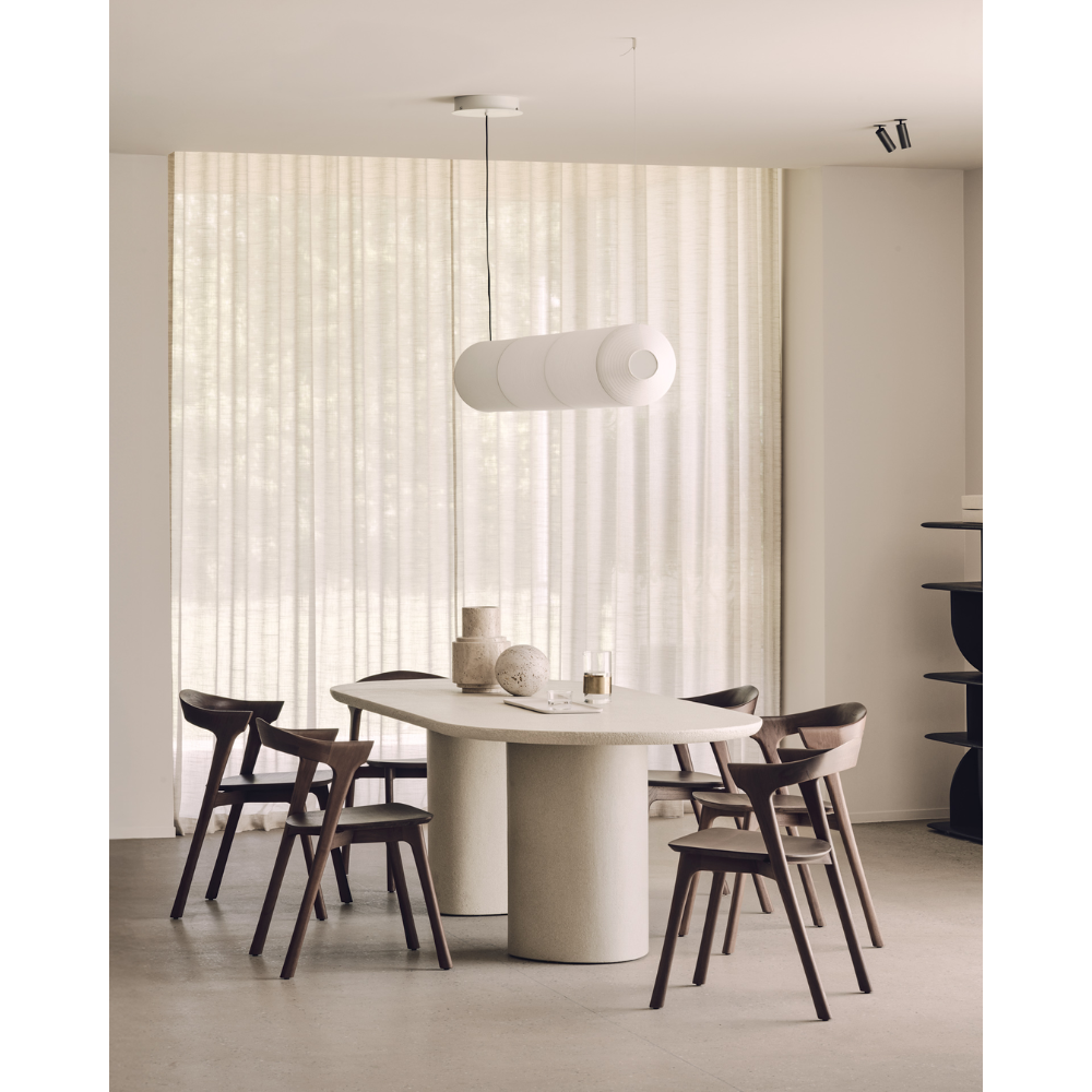 The Elements Oblong Dining Table by Ethnicraft in a modern dining room with Bok dining chairs.