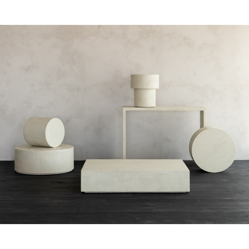 The Elements Round Coffee Table from Ethnicraft in a studio showing the entire Elements collection. all-groups