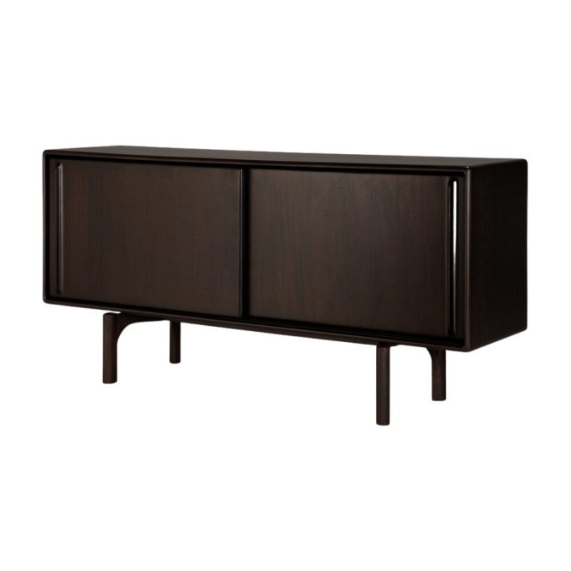 The 66-inch Flow Sideboard by Ethnicraft is a dark brown sideboard with two doors, from a side angle.