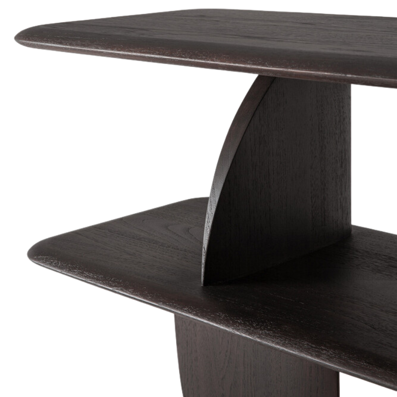 The Geometric Sofa Console from Ethnicraft in dark brown teak focusing on the shelving.