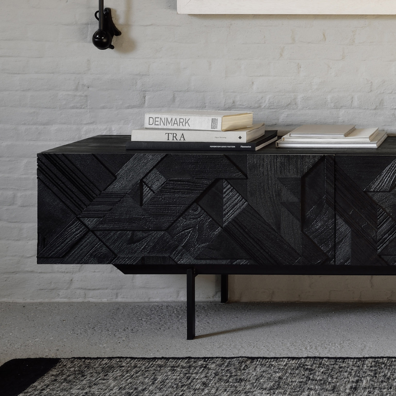 The Graphic TV Cupboard from Ethnicraft in a den.