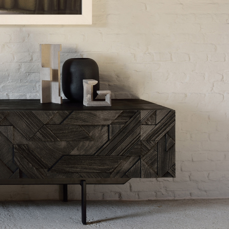 The Graphic TV Cupboard from Ethnicraft in an entryway.