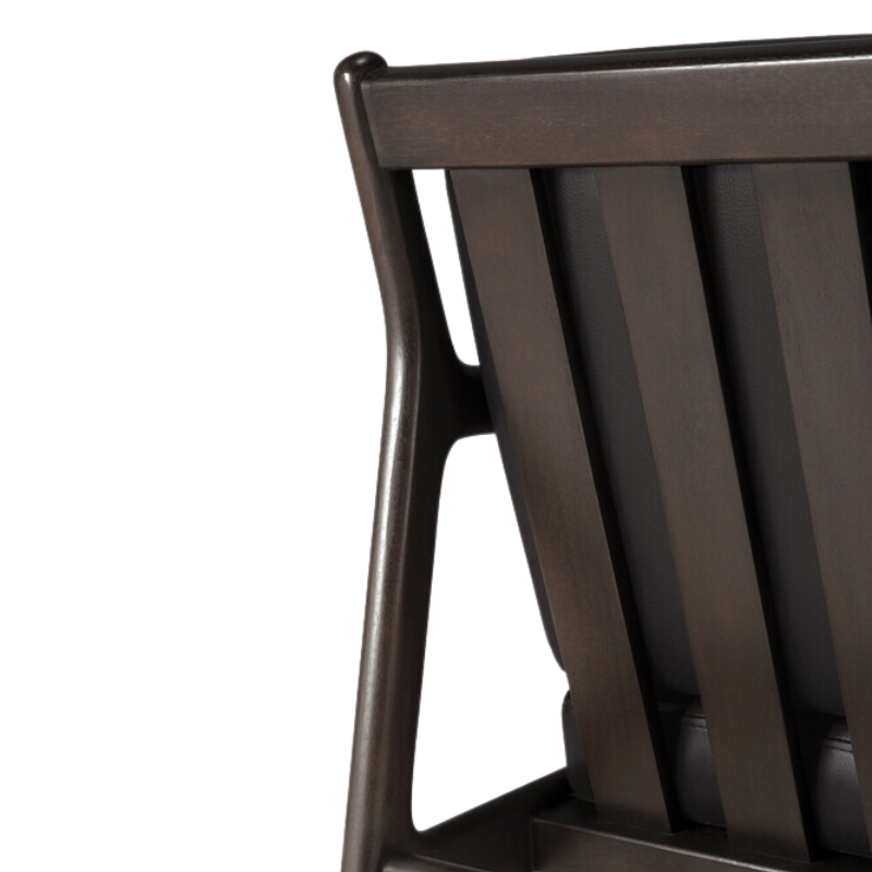 The Jack Lounge Chair from Ethnicraft with a black leather cushion in detail.