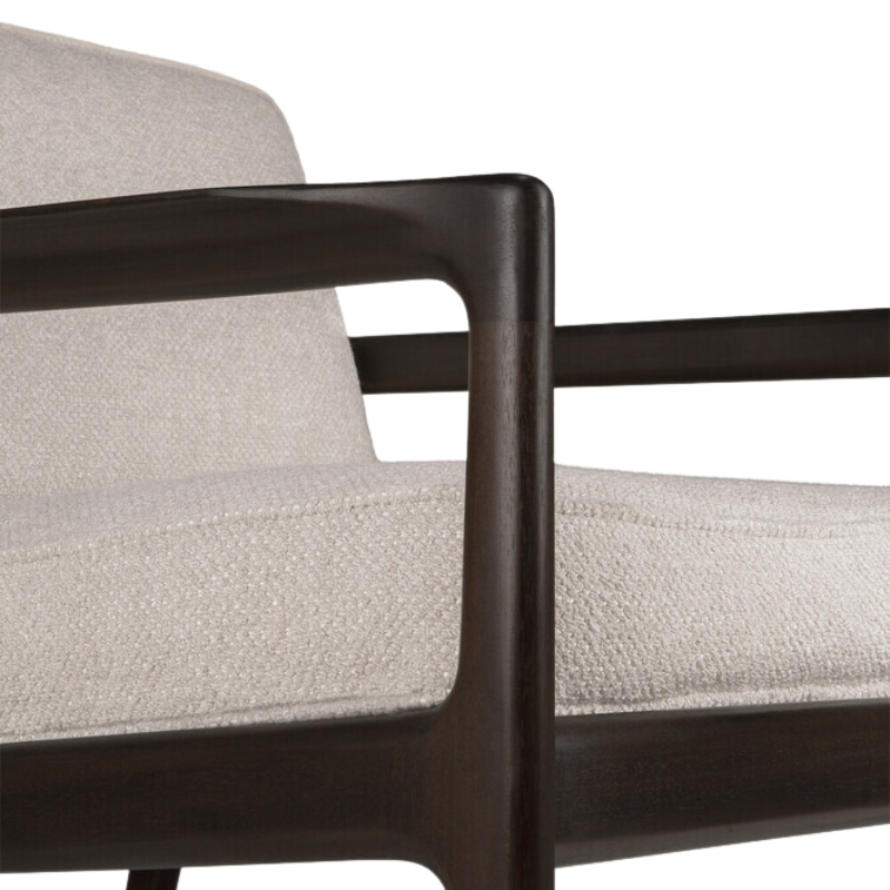The Jack Lounge Chair from Ethnicraft with an ivory cushion close up.