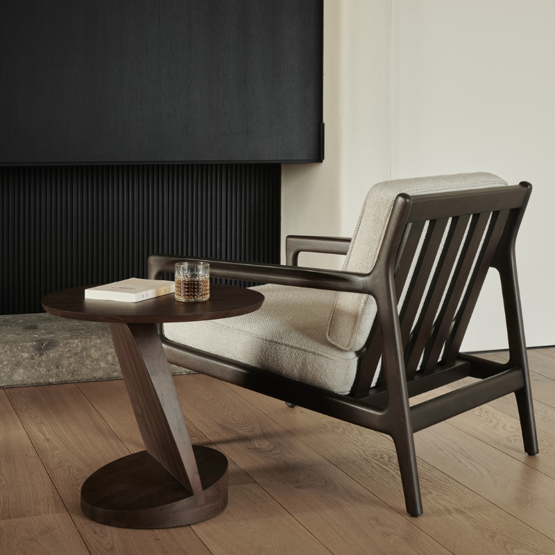 The Jack Lounge Chair from Ethnicraft with an ivory cushion in a living room.