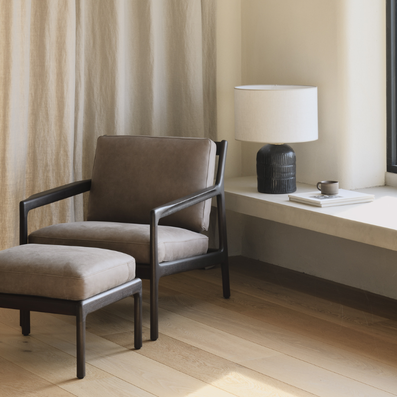 The Jack Lounge Chair from Ethnicraft with a terra nubuck leather cushion in a home.