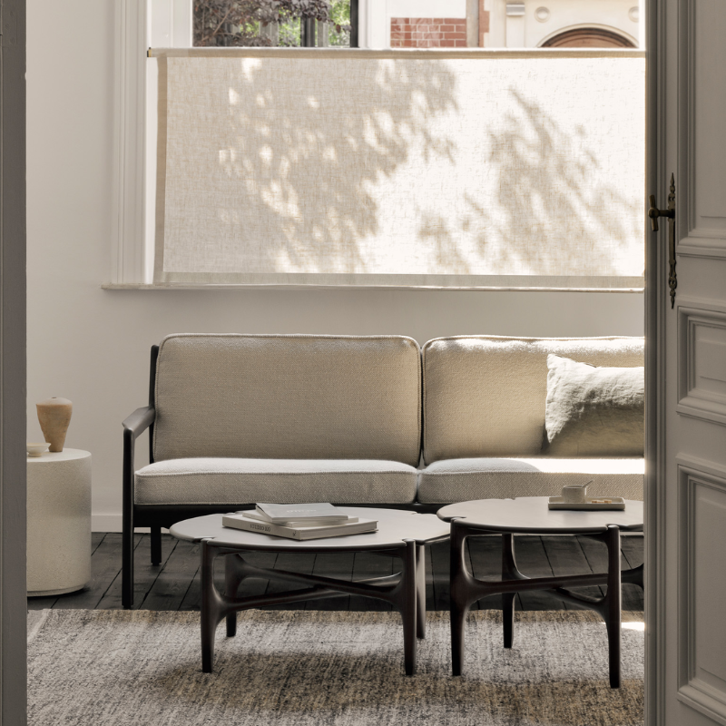 The Jack Sofa by Ethnicraft with Ivory Cushion in a living room.
