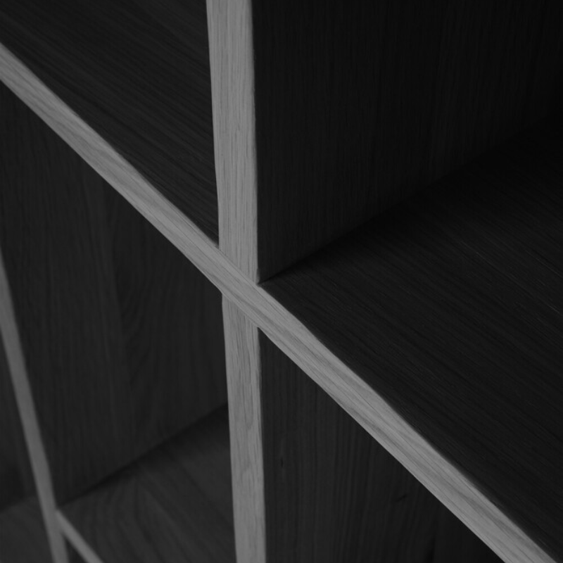 The M Rack from Ethnicraft large size in black oak close up.