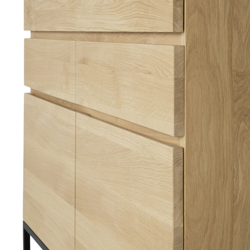 The Stairs Cupboard by Ethnicraft with a close-up from the side corner of the cupboard.