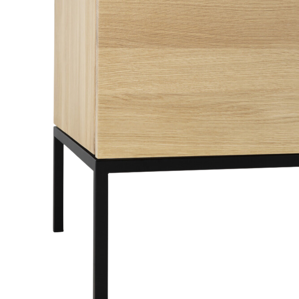 The Linga Cupboard from Ethnicraft with a leg close-up.