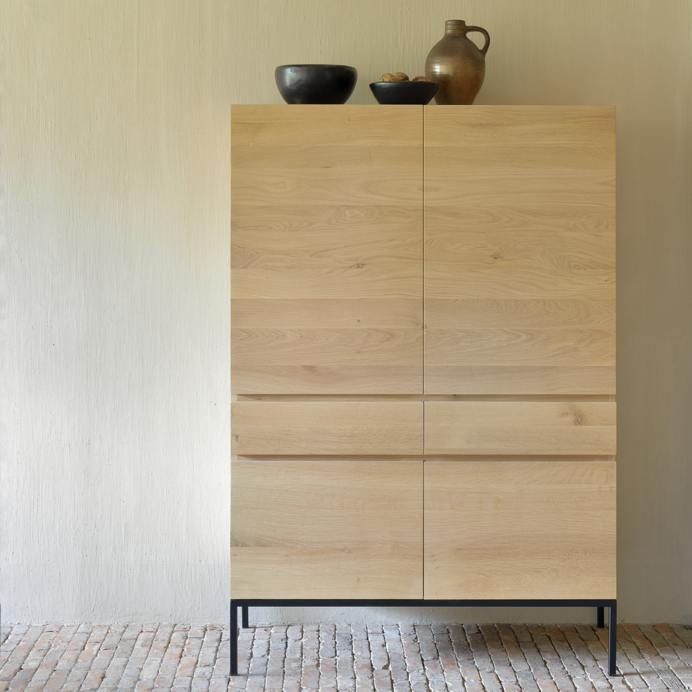 The Linga Cupboard from Ethnicraft in a living room.