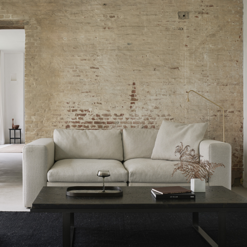 The Mellow Cushion from Ethnicraft in off white in a family area.