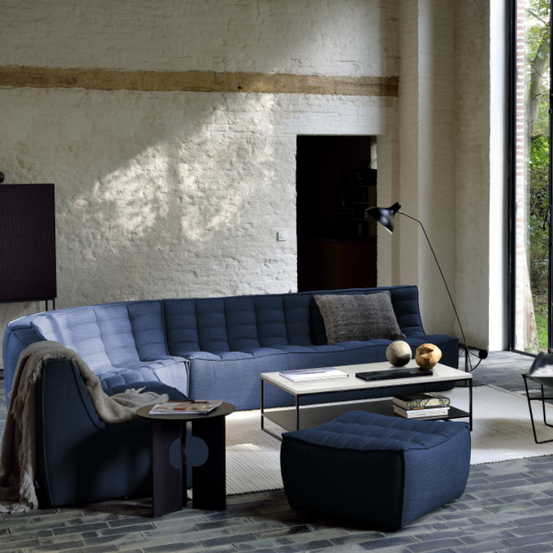 The N701 Corner Unit from Ethnicraft with blue standard fabric in a living space.