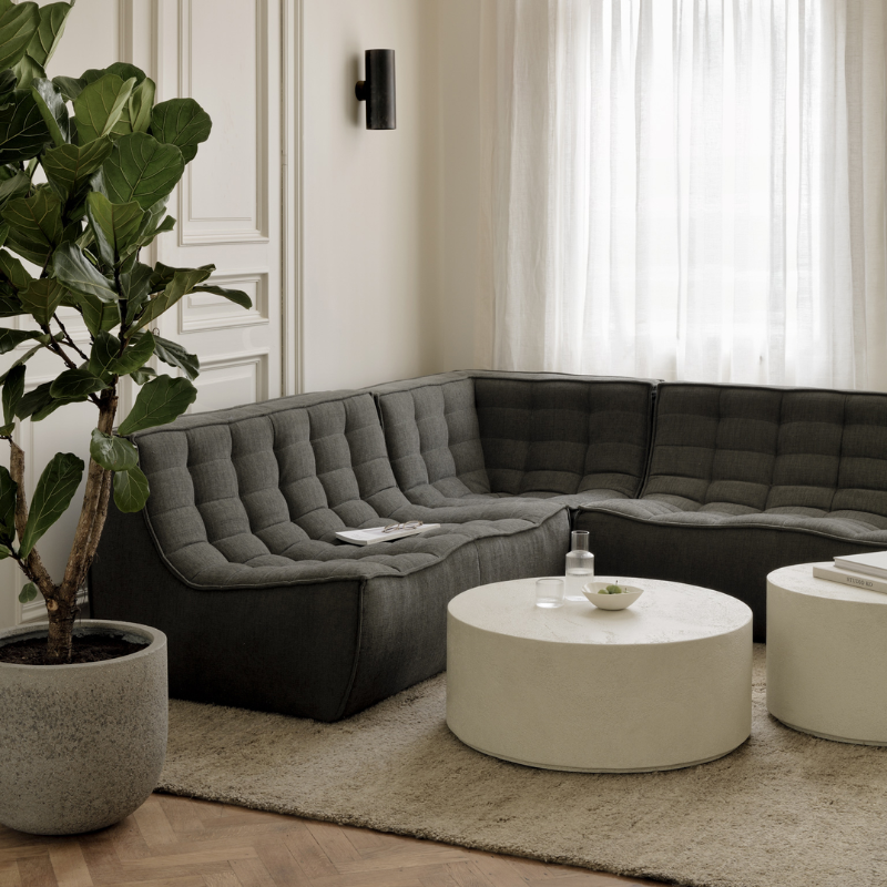The N701 Corner Unit from Ethnicraft with moss eco fabric in a family area.