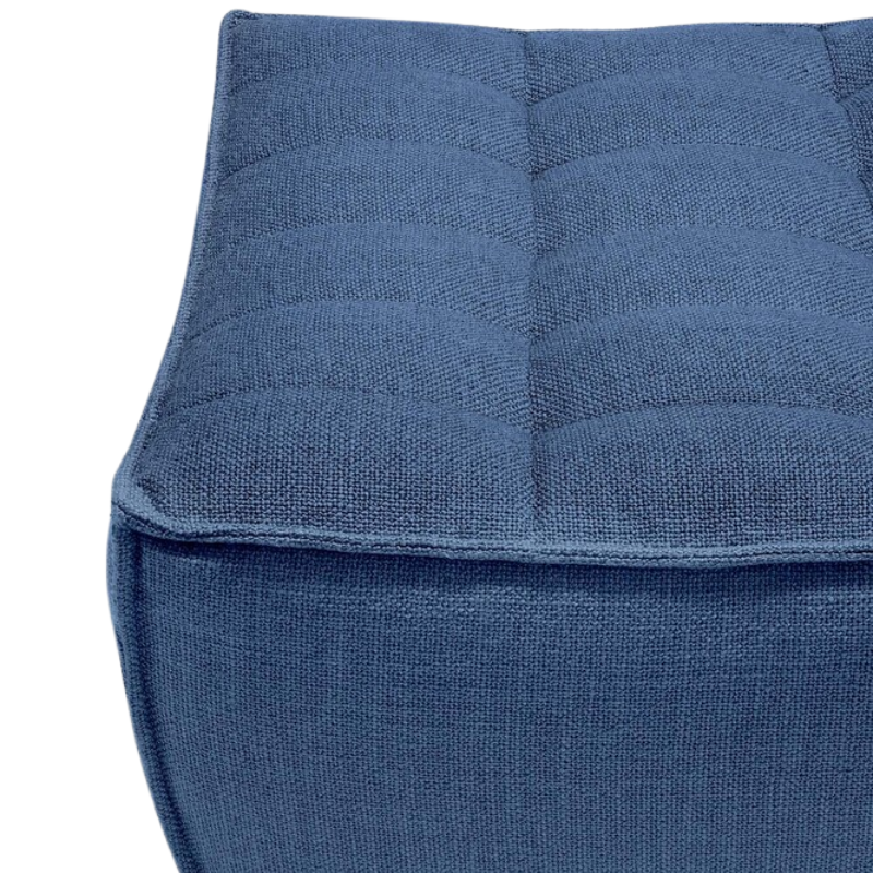 The N701 Footstool from Ethnicraft with blue standard fabric close up.