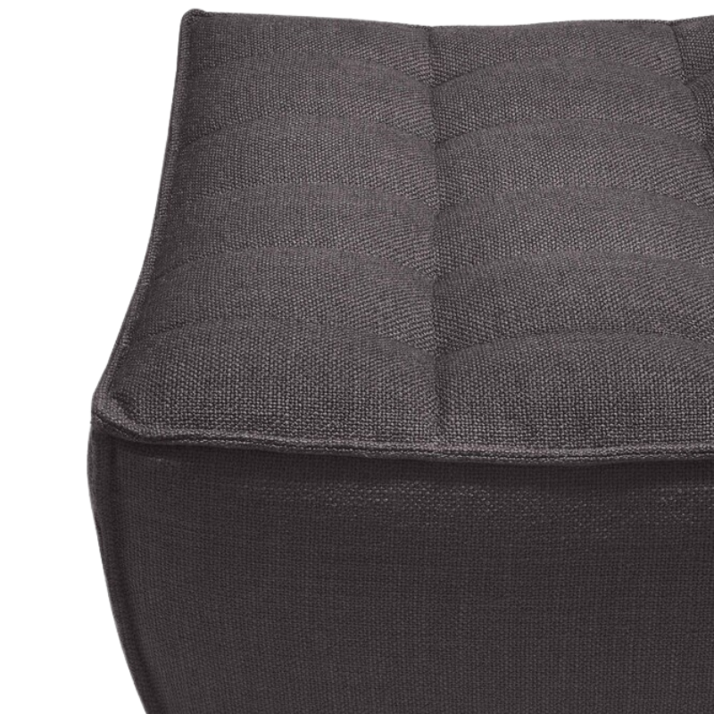 The N701 Footstool from Ethnicraft with dark grey standard fabric close up.