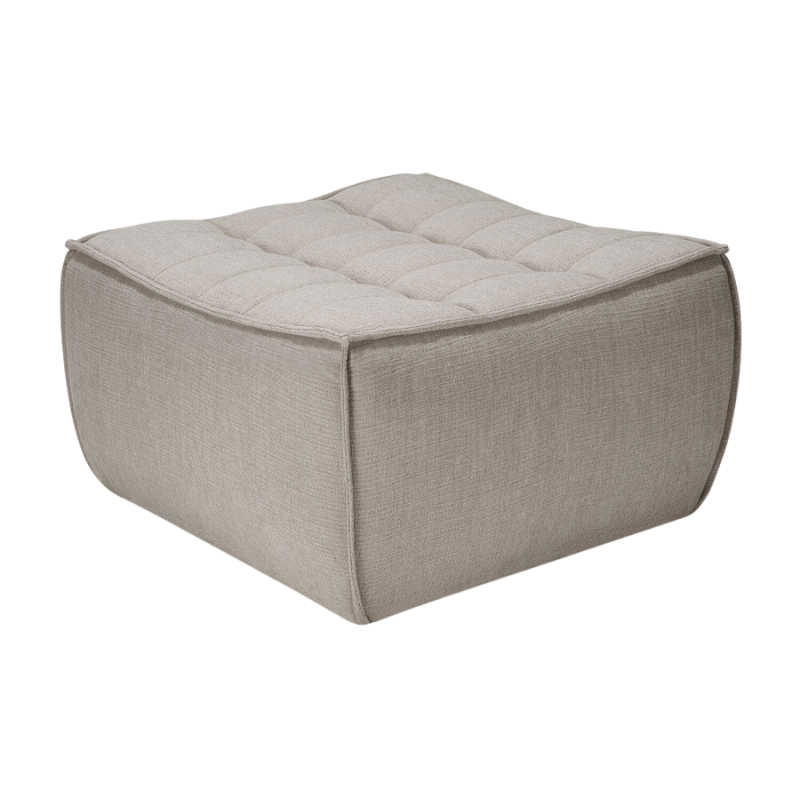 The N701 Footstool from Ethnicraft with ecru eco fabric from an angle.