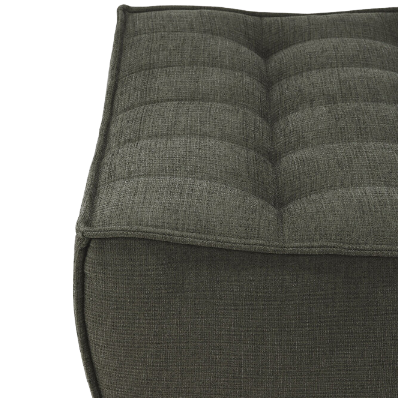 The N701 Footstool from Ethnicraft with moss eco fabric in detail.