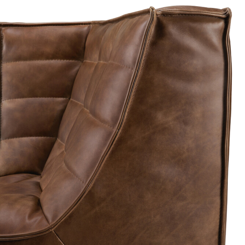 The N701 Leather Corner Chestnut by Ethnicraft from the side angle.