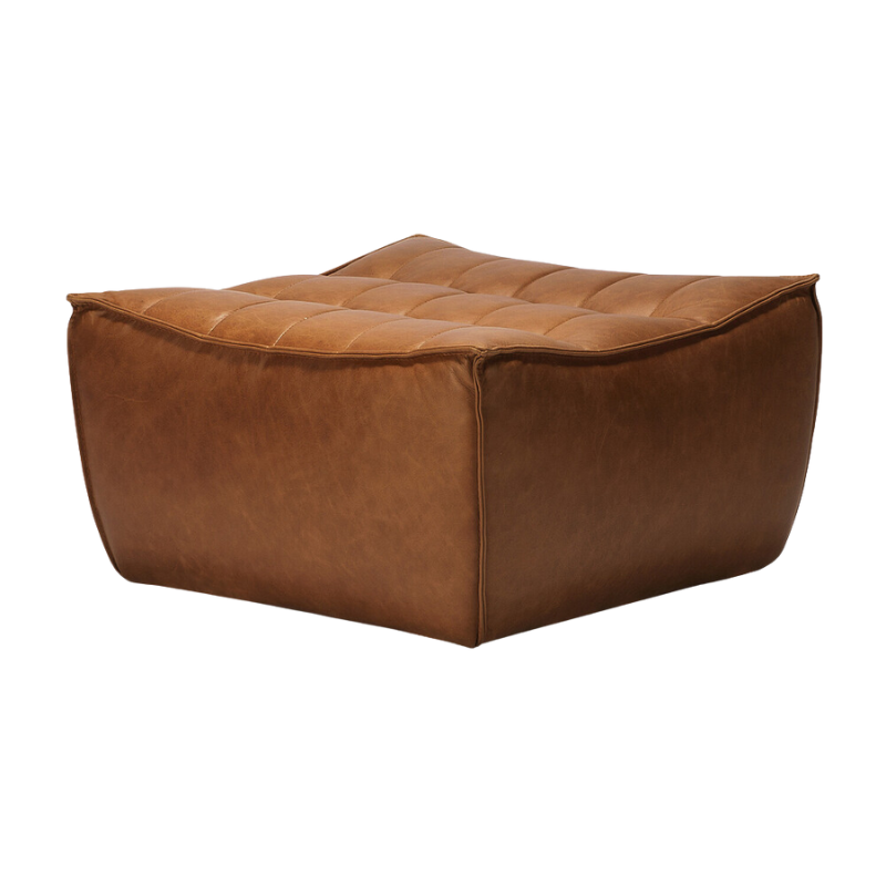 The N701 Leather Footstool from Ethnicraft from an angle.