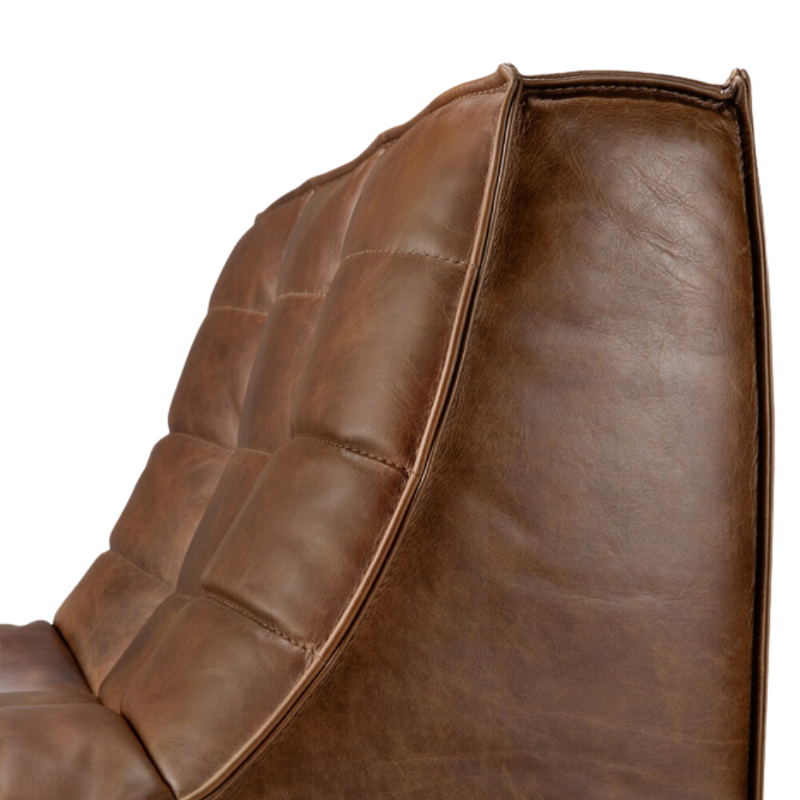 The N701 Leather One Seater Chestnut by Ethnicraft with a close-up of the backrest from the side.