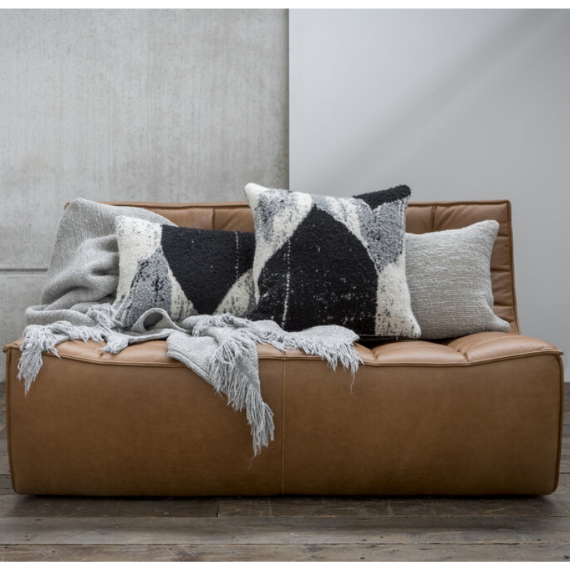 The N701 Leather Two Seater Sofa from Ethnicraft in a lounge.