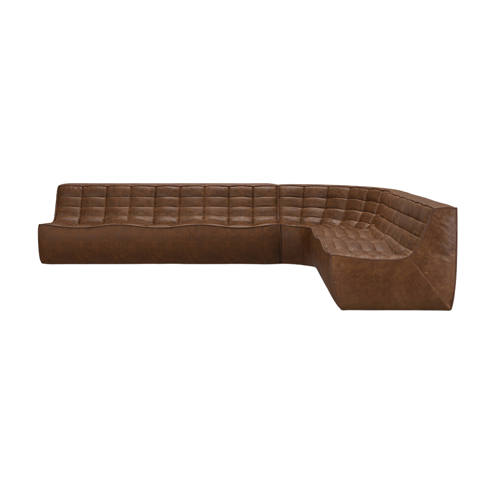 The right lounger N701 Modular Round Corner Sofa 1-3 from Ethnicraft with chestnut aniline leather.