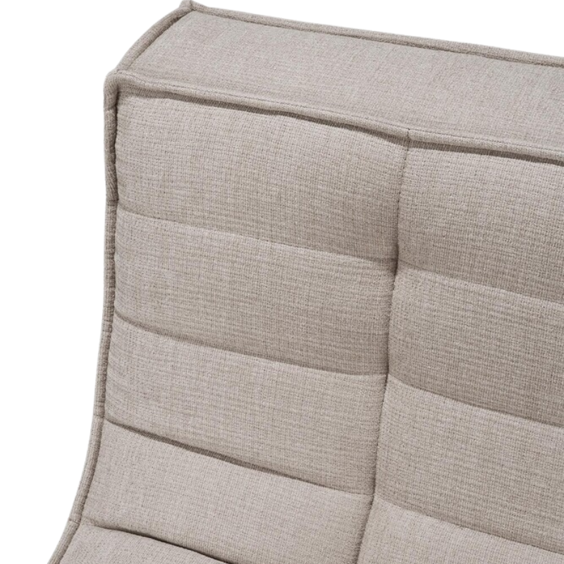 The N701 Modular Round Corner Sofa 2-3 from Ethnicraft in Ecru eco fabric from the top edge, close-up. all-groups