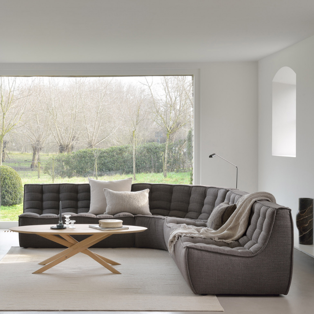 The N701 Modular Sofa from Ethnicraft with dark gray standard fabric in a family area.