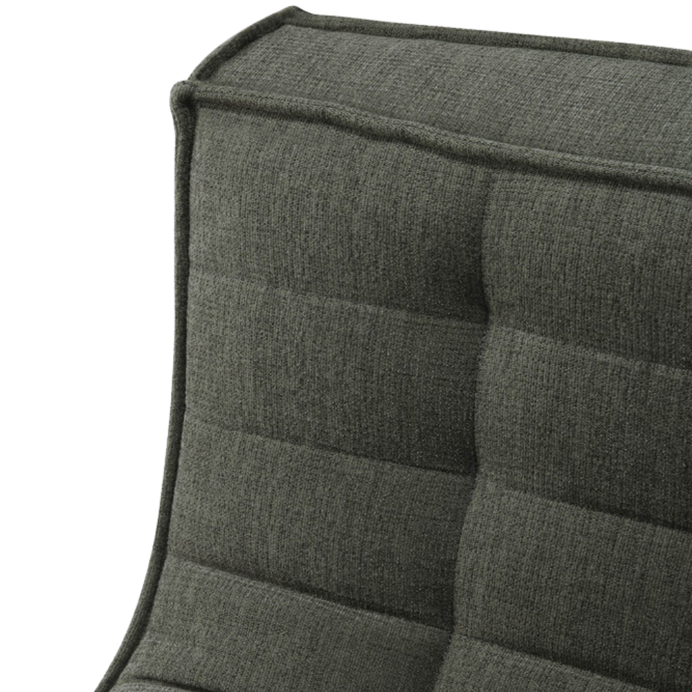 The N701 Modular Sofa from Ethnicraft with moss eco fabric focusing on the backrest.