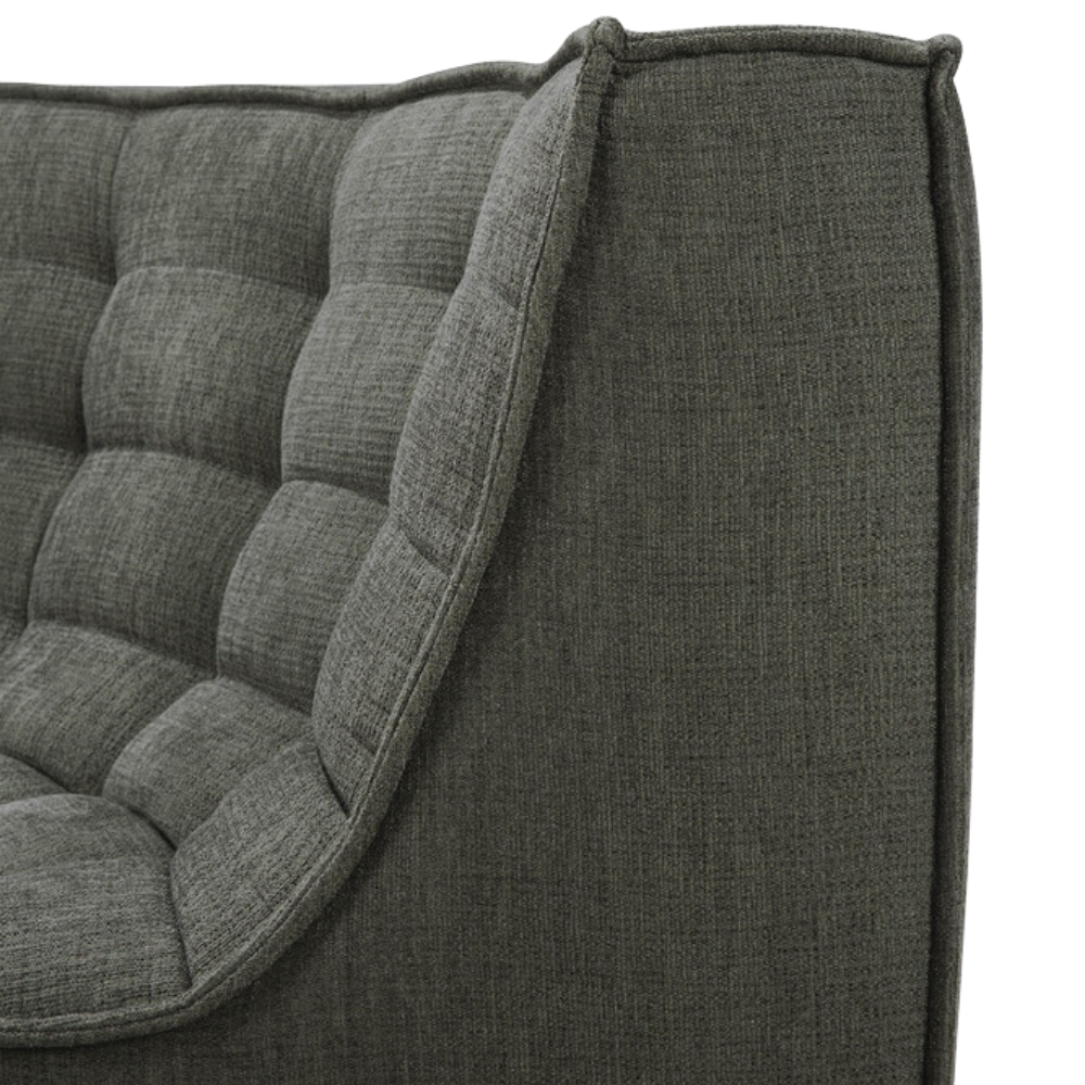 The N701 Modular Sofa from Ethnicraft with moss eco fabric showing the curved backrest.