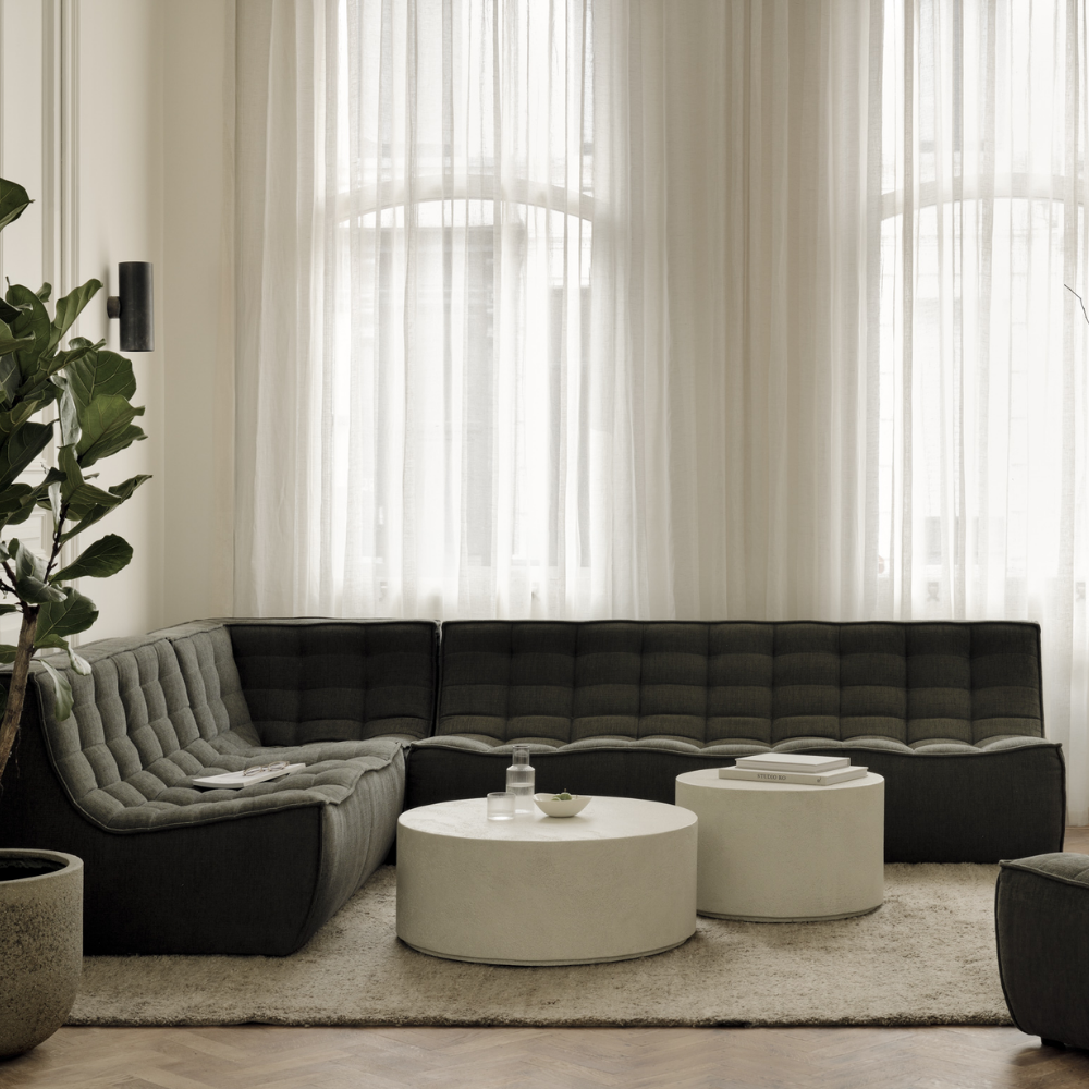 The N701 Modular Sofa from Ethnicraft with moss eco fabric in a living room.