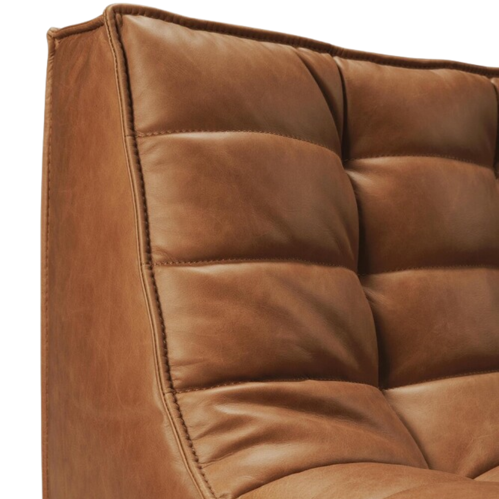 The N701 Modular Sofa from Ethnicraft with old saddle aniline leather focusing on the back rest