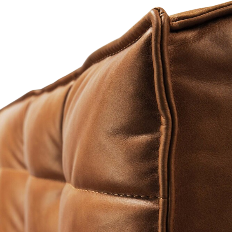 The N701 Modular Square Corner Sofa 1-3 Old Saddle from Ethnicraft with a close-up from the side angle.