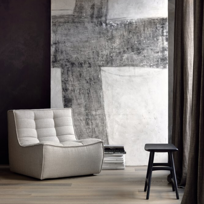 The N701 One Seater from Ethnicraft with beige standard fabric in an office.