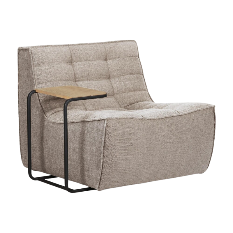 The N701 One Seater from Ethnicraft with beige standard fabric and a side table from an angle.