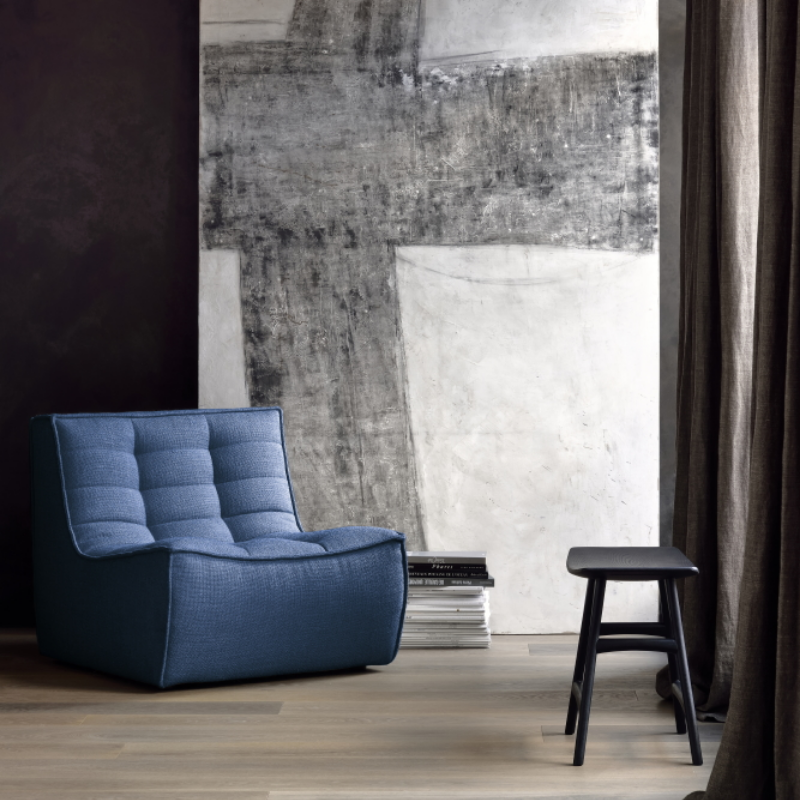 The N701 One Seater from Ethnicraft with blue standard fabric in a home office.