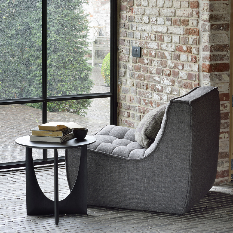 The N701 One Seater from Ethnicraft with dark grey standard fabric in a family space.