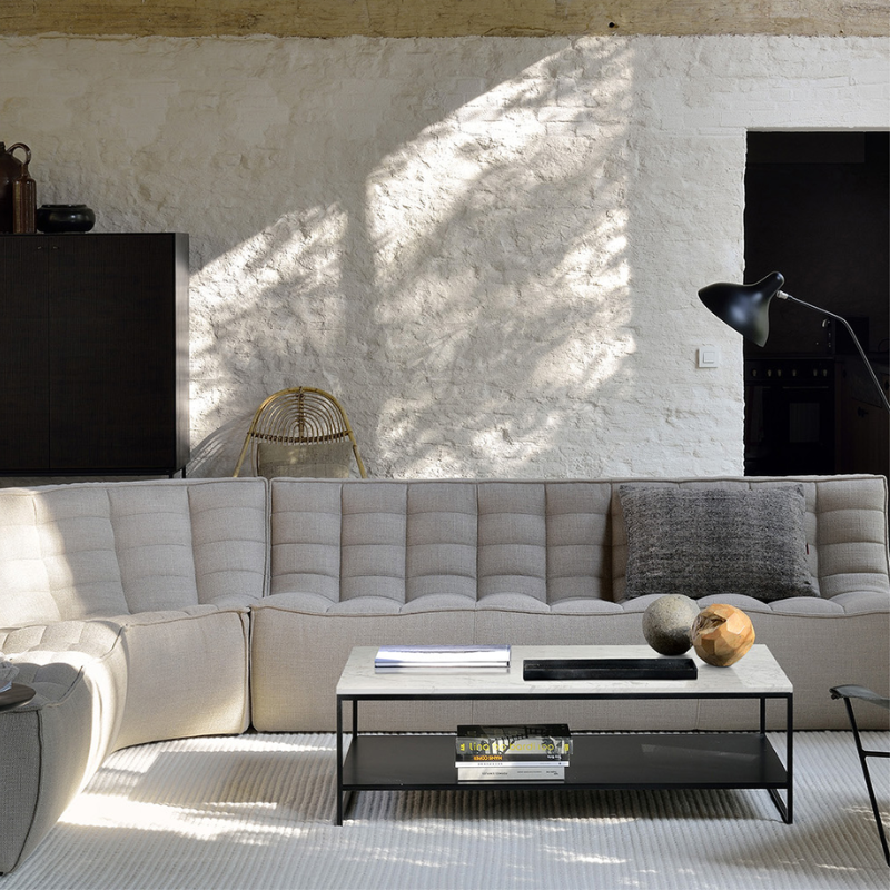 The N701 Round Corner from Ethnicraft in beige standard fabric in a living room.