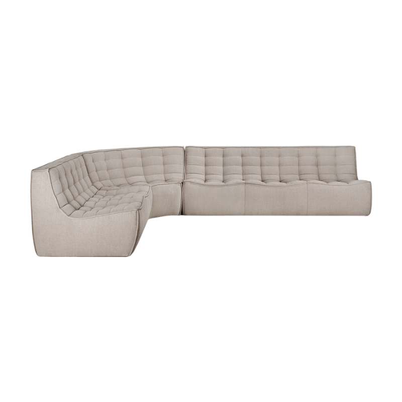 The N701 Round Corner from Ethnicraft in ecru eco fabric in a sofa setup with a round corner.